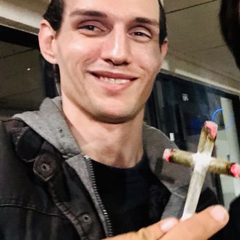 Copa Cabana - a man with a cigarette in his hand - Bars Near Me - Nashville, Tennessee