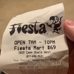 a hand holding a ticket for fiesta a hand holding a ticket for fiesta