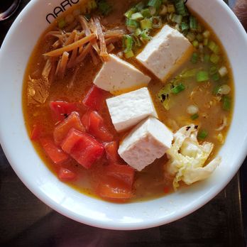 Mampuku Ramen - Vegetable Raman - A bowl of vegetable ramen featuring tofu, chopped tomatoes, green onions, bamboo shoots, and cabbage in a broth. - Ramen Near Me - Santa Fe, New Mexico