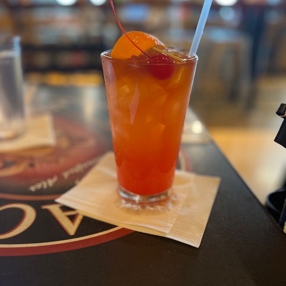 Africa Lounge - a glass of orange juice on a table - American Near Me - SeaTac, Washington Africa Lounge - a glass of orange juice on a table - American Near Me - SeaTac, Washington