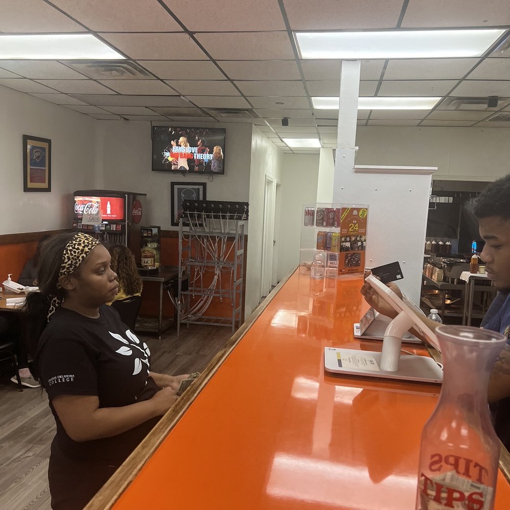 Wing Supreme - two people sitting at a bar - Chicken Wings Near Me - Oklahoma City, Oklahoma Wing Supreme - two people sitting at a bar - Chicken Wings Near Me - Oklahoma City, Oklahoma