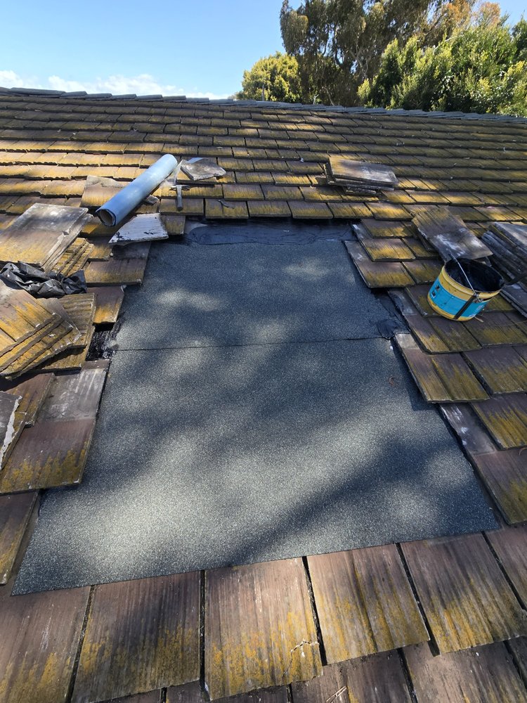 Slide of J&E Roofing Services