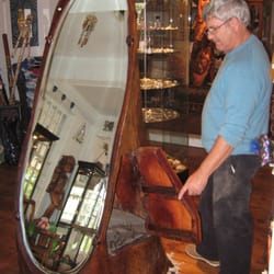 Yak Arts - The owner Bob with one of the many spectacular pieces in the shop!