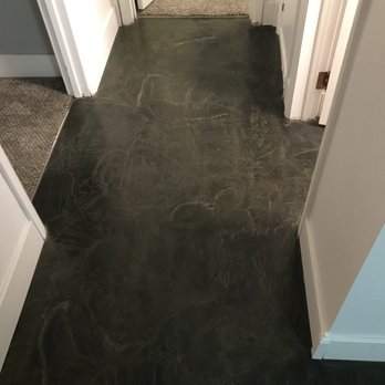 Cornerstone Styles - a hallway with a black floor - Flooring Near Me Cornerstone Styles - a hallway with a black floor - Flooring Near Me