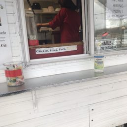 On her phone while making food On her phone while making food
