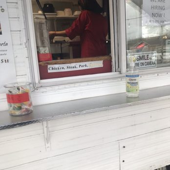 MamaChio Mayan - On her phone while making food - Food Trucks Near Me - Portland, Oregon MamaChio Mayan - On her phone while making food - Food Trucks Near Me - Portland, Oregon