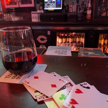 Third Rail Tavern - a glass of wine and playing cards - Bars Near Me - Chicago, Illinois