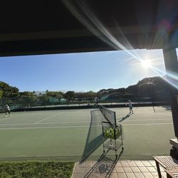 Seaside Tennis Club - Morning Tennis with the sun rising over Mauna Kea. One of the best time to get a lesson at Seaside Tennis Club!