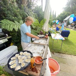 Charleston Oyster Farm - Mobile shucking station.  Farmers shucking oysters for you that they harvested that morning is hard to beat!