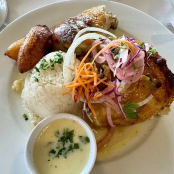 Coco Palm Restaurant - Pollo Asado Plate - Breast & thigh sections basted with garlic sauce, a mound of mashed potatoes, pickled onions, and sliced plantains. - Cuban Near Me - Pomona, California