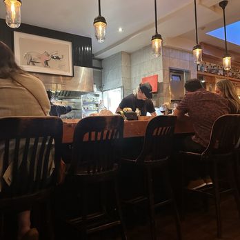 Au Pied de Cochon - Fun sitting near the kitchen. - Canadian (New) Near Me - Montreal, Quebec