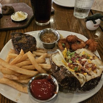 Outback Steakhouse - Sirloin with Coconut shrimp, baked potato and fries - Steakhouses Near Me - Oviedo, Florida