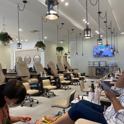 Qq Nail Lounge - A view of the adult pedicure chairs from a chair