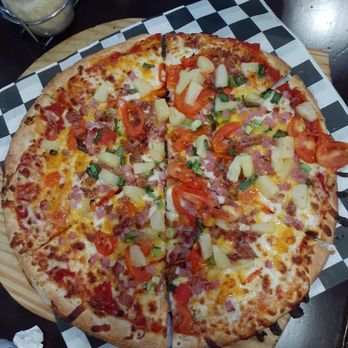 The Pizza Press - Celebration - Sun pizza: pineapple, tomato, bacon and ham - Pizza Near Me - Kissimmee, Florida The Pizza Press - Celebration - Sun pizza: pineapple, tomato, bacon and ham - Pizza Near Me - Kissimmee, Florida
