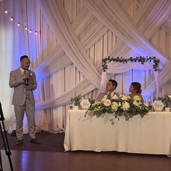 La Mission Flowers & Gifts - my bridal bouquet, white draping and hanging floral arrangement (repurposed for my sweetheart table) all created by Miriam