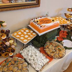 Ambrosia Bakery - How the princess cake with orange marzipan looked with the rest of the dessert table for "A Little Cutie is on the Way" baby shower!