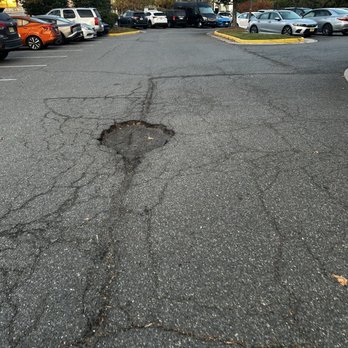 Courtyard by Marriott Springfield - One of many potholes in the parking lot - Hotels Near Me - Springfield, Virginia Courtyard by Marriott Springfield - One of many potholes in the parking lot - Hotels Near Me - Springfield, Virginia