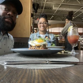 Southern National - Us sitting in a booth. FYI: They are very comfy like my couch. - Southern Near Me - Atlanta, Georgia