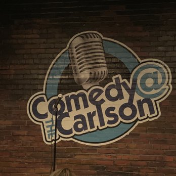 Comedy @ The Carlson - a woman standing in front of a microphone - Comedy Clubs Near Me - Rochester, New York