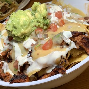 BZ Taco - BZ Nachos: Protein Choice (Al Pastor), Fresh-made Tortilla Chips, Beans, Nacho Cheeze, Pico de Gallo, Vegan Crema, Guacamole, Jalapeños. - Mexican Near Me - Redlands, California BZ Taco - BZ Nachos: Protein Choice (Al Pastor), Fresh-made Tortilla Chips, Beans, Nacho Cheeze, Pico de Gallo, Vegan Crema, Guacamole, Jalapeños. - Mexican Near Me - Redlands, California