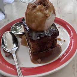 Sticky toffee cake, dessert with vanilla ice cream