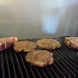 steaks cooking on the grill steaks cooking on the grill