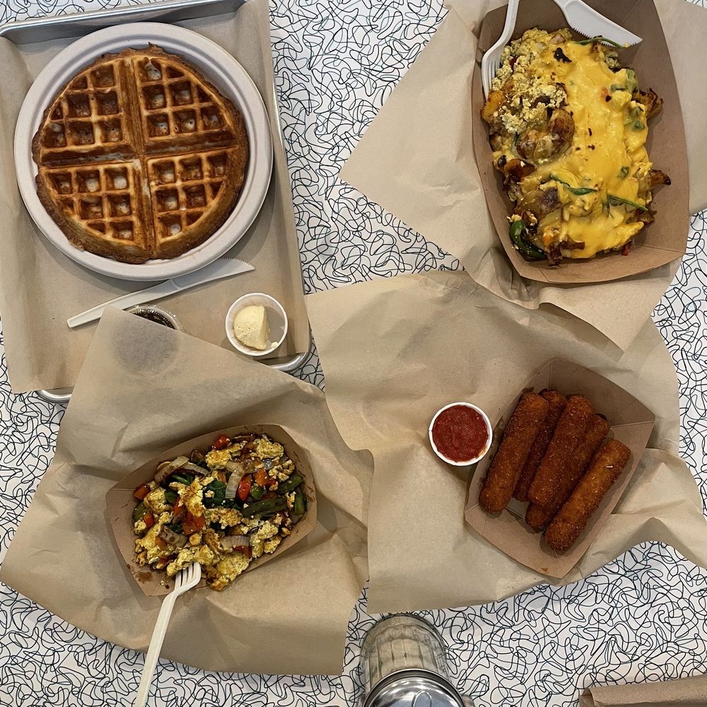 Angelhearts Donuts - Waffle, side of tofu scramble, skillet scramble and mozz sticks - Vegan Near Me - Ithaca, New York Angelhearts Donuts - Waffle, side of tofu scramble, skillet scramble and mozz sticks - Vegan Near Me - Ithaca, New York
