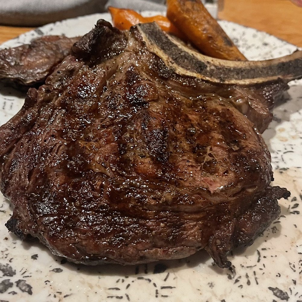 Bigfire - Ribeye steak with smashed potatoes and carrots - American Near Me - Orlando, Florida Bigfire - Ribeye steak with smashed potatoes and carrots - American Near Me - Orlando, Florida