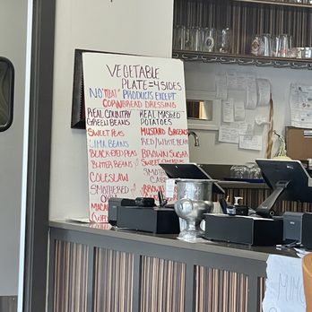 Zeeland Street - a restaurant counter with a menu on it - Soul Food Near Me - Baton Rouge, Louisiana