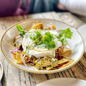 Steel & Rye - Chilaquiles- roasted chicken, salsa verde, sour cream, red onion, cilantro, fried egg - American Near Me - Milton, Massachusetts