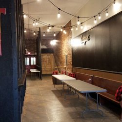 Main Street Axe Company - Setting up for a party in front of the dual axe throwing lanes