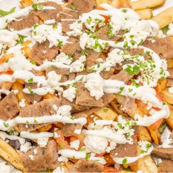 The Wrap Shack - Gyro Fries, topped to order with Tzatziki, Feta Cheese & Tomato