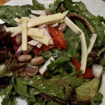 Ulele - Tasty house salad but unfortunately DROWNING in dressing. Ask for dressing on the side (& I normally like a lot of dressing) - New American Near Me - Tampa, Florida