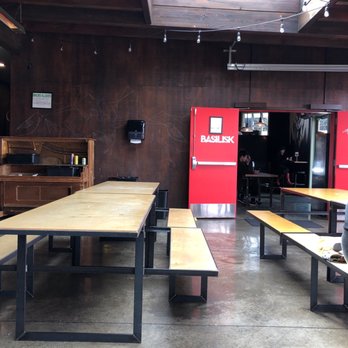 Basilisk - Inside seating area with a sun roof - New American Near Me - Portland, Oregon