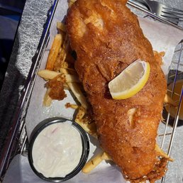 The fish and chips that was dripping with oil. The fish and chips that was dripping with oil.