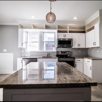 Kitchen Payments - a kitchen with granite counter tops - General Contractors Near Me - Chicago, Illinois Kitchen Payments - a kitchen with granite counter tops - General Contractors Near Me - Chicago, Illinois