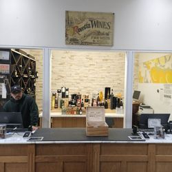 Rosetta Wines - Spirits behind the counter. Alex is very knowledgeable in helping you pick out the perfect wine.