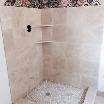 GD Tile and Stone - A LIGHT AND BRIGHT TRAVERTINE SHOWER SURROUND. THIS SHOWER OFFERS HAND PAINTED DECO TILES AS A BORDER ACCENT . - General Contractors Near Me - El Cajon, California