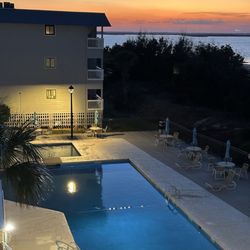 Tybee Time Vacation Rentals - Sunset over the pool from the condo front door