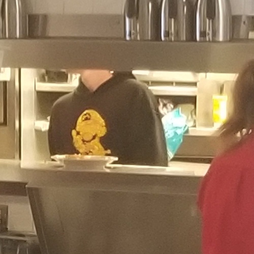 Employee on the line wearing a hooded shirt with Mario from Nintendo raising the middle finger. My kid saw this. Employee on the line wearing a hooded shirt with Mario from Nintendo raising the middle finger. My kid saw this.