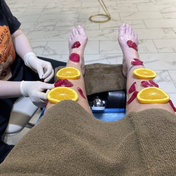 LA VIE Nails & Spa - The golden pedicure with warm orange slices and rose petals - Nail Salons Near Me - Selbyville, Delaware