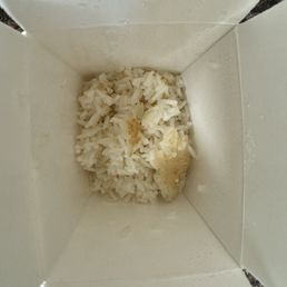White rice scraped from the bottom of the pot and served with curry for $16 White rice scraped from the bottom of the pot and served with curry for $16