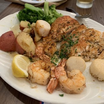 SKD Kitchen And Drinks - Broiled Seafood combination with roasted potatoes. - Pizza Near Me - Saint Pete Beach, Florida SKD Kitchen And Drinks - Broiled Seafood combination with roasted potatoes. - Pizza Near Me - Saint Pete Beach, Florida