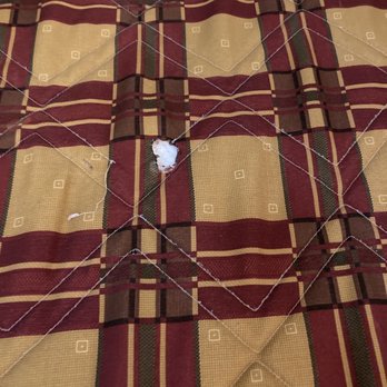 7 Gables Inn & Suites - Burned blanket covers in ashes. Obviously unwashed! - Hotels Near Me - Fairbanks, Alaska