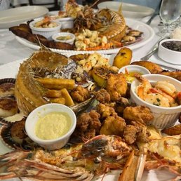 Special Platter - langostino shrimp, lobster, Snapper, shrimp, clams, plantains, black beans and white rice, and other things! Special Platter - langostino shrimp, lobster, Snapper, shrimp, clams, plantains, black beans and white rice, and other things!