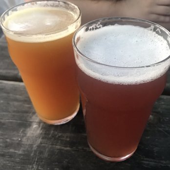 Hellbent Brewing Company - Left: Peach IPA Right: Triple Berry Wheat - Sports Bars Near Me - Seattle, Washington Hellbent Brewing Company - Left: Peach IPA Right: Triple Berry Wheat - Sports Bars Near Me - Seattle, Washington