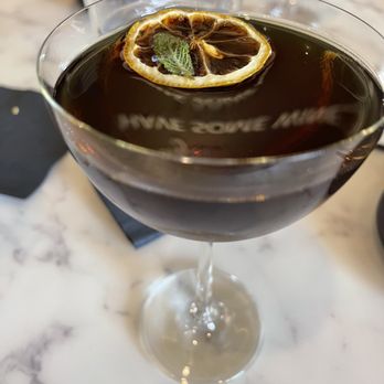 Rosalia's Kitchen - The Bitter Truth = Dry Vermouth, Cocchi Americano, Sherry, Triple Sec, Grapefruit Bitters. (W a "Have some Wine reflection") - Italian Near Me - Miramar, Florida Rosalia's Kitchen - The Bitter Truth = Dry Vermouth, Cocchi Americano, Sherry, Triple Sec, Grapefruit Bitters. (W a "Have some Wine reflection") - Italian Near Me - Miramar, Florida
