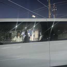 Our rental car in the Sora Ramen parking lot with the windows shattered. Our rental car in the Sora Ramen parking lot with the windows shattered.