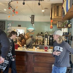 a group of people in a coffee shop a group of people in a coffee shop