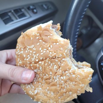 McDonald's - a hand holding a sesame bun - Fast Food Near Me - Jamaica, New York McDonald's - a hand holding a sesame bun - Fast Food Near Me - Jamaica, New York